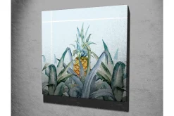 Canvastavla - Ananas omgiven av gröna växter