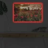 Canvastavla med LED-belysning - Blomstrande vallmofält i solnedgångens ljus