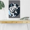 Canvastavla med LED-belysning - Astronaut som spelar gitarr i rymden