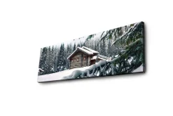 Canvastavla med LED-belysning 30x90 cm - Vinterlandskap med en stuga omgiven av snö och granar