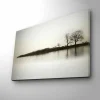 Canvastavla med LED-belysning - Silhuett av träd vid en stilla sjö i gråtoner