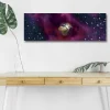 Canvastavla med LED-belysning - Jorden omgiven av en stjärnklar rymd med färgglada nebulosor