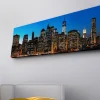 Canvastavla med LED-belysning - Stadssilhuett av New York i skymning