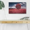 Canvastavla med LED-belysning - Ståtligt rosa träd på en färgglad äng