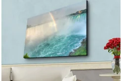 Canvastavla med LED-belysning - Storslagen vy av Niagarafallen med en regnbåge i bakgrunden