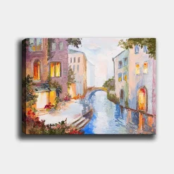Canvastavla 70x100 cm - Pittoresk kanal med färgglada hus och en bro som speglas i vattnet