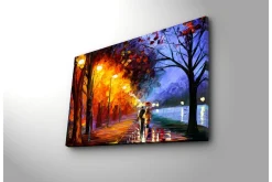 Canvastavla 70x45 cm - Romantisk promenad under regn med paraplyer i en färgglad höstmiljö