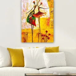 Canvastavla 70x100 cm - Två stiliserade dansare i färgglada klänningar som uttrycker glädje och rörelse